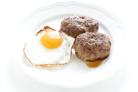 Sunny side up fried egg and homemade pattyの写真素材