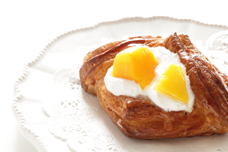 Mango and yogurt on pastryの写真素材