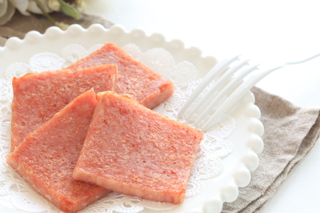 Pan fried luncheon meat on dishの写真素材