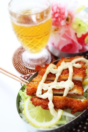 Fried chicken and lemon on rice bentoの写真素材