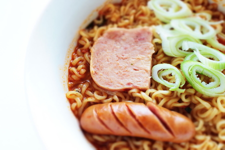Korean food, luncheon meat and sauce on chili ramen noodlesの写真素材