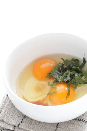 Japanese cooking, egg and soy sauce with obaの写真素材
