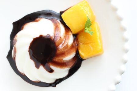 Chinese dessert, almond tofu and mango with chocolate sauceの写真素材