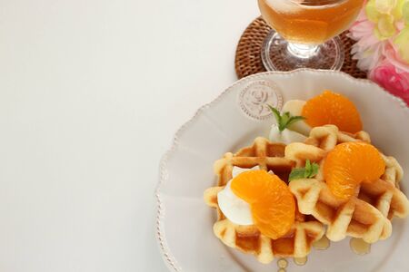 Canned mandarin orange and waffle for gourmet breakfastの写真素材