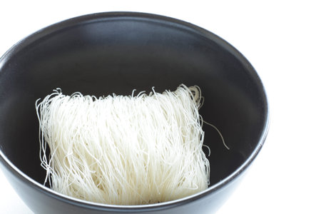Rice noodle in black bowl for asian food ingredient
