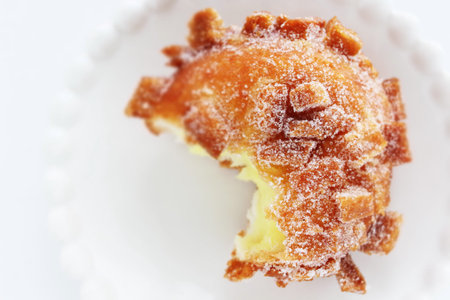 Sugar deep fried bread on dish with copy space