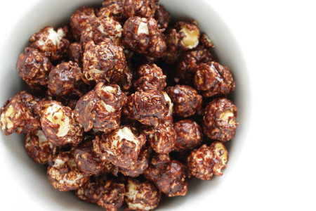 Chocolate sweet popcorn in bowl with copy space