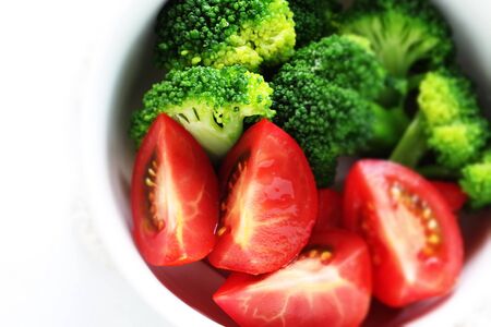 Healthy food, boiled broccoli and tomato saladの写真素材
