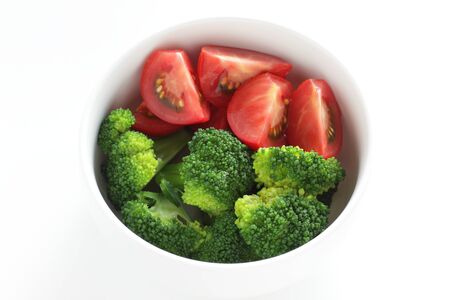 Healthy food, boiled broccoli and tomato saladの写真素材