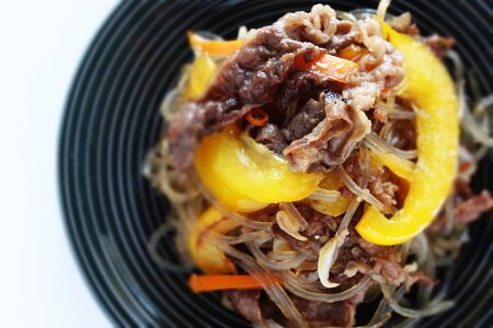 Korean food, beef and yellow paprika japchae glass noodles stir friedの写真素材
