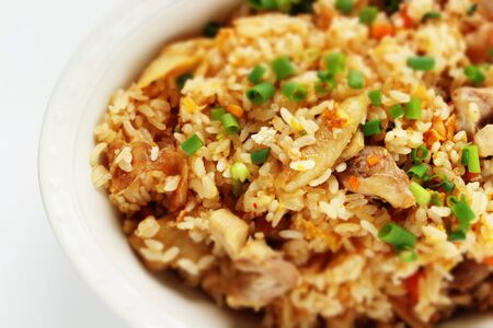 Korean food, chicken and kimchi fried rice with spring onionの写真素材