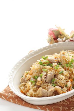 Korean food, chicken and kimchi fried rice with spring onionの写真素材