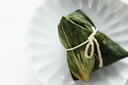 Chinese dumpling, meat and sticky rice wrapped zongziの写真素材