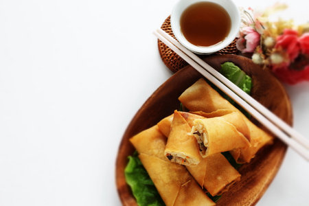 Chinese food, spring roll on wooden plate