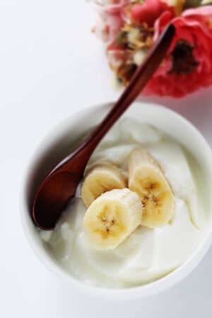 Banana and honey on yogurt for healthy breakfastの写真素材