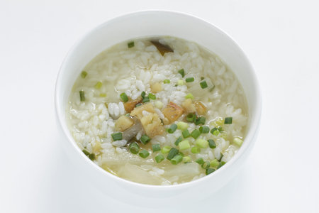 Korean food, cod fish and spring onion in soup riceの写真素材