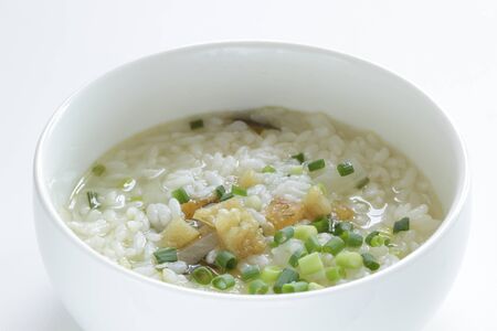 Korean food, cod fish and spring onion in soup riceの写真素材