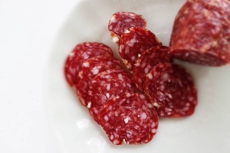 Italian food, salami on dish with copy spaceの写真素材