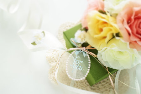 Artificial flower and gift box with ribbon