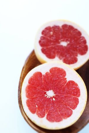 Freshness red ruby grapefruit in half on whiteの写真素材