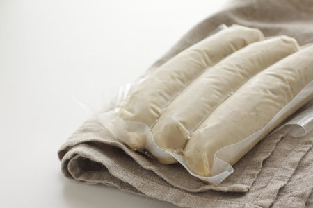 Packed food, pork and spice sausage on white background with copy space space