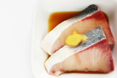 Freshness Japanese yellowtail fish on plateの写真素材