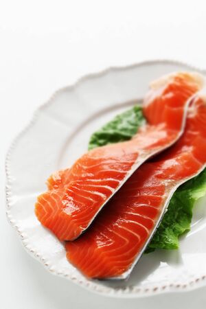 Freshness salmon fish fillet on lettuce for prepared ingredientの写真素材