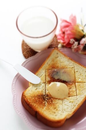 Vanilla condensed milk on toast for delicious breakfastの写真素材