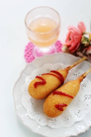 American junk food, corn dog on lace pepper with copy spaceの写真素材