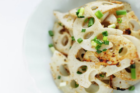 Chinese food, lotus root and sesame stir fried with sesame seedの写真素材