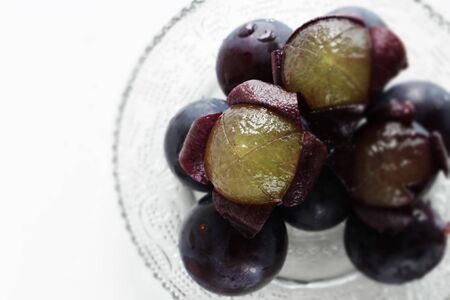 peeled Japanese grape on dish with copy spaceの写真素材