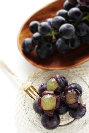 peeled Japanese grape on dish with copy spaceの写真素材