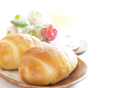 Homemade butter roll bread on wooden plate