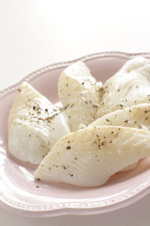 Prepared flat fish and pepper on dish for cooking ingredient