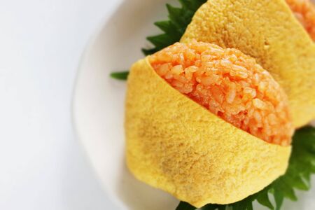 Japanese food, ketchup and wrapped egg rice ballの写真素材