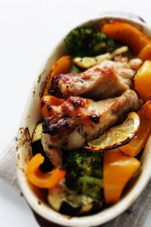 Oven cooking, chicken drumsticks and assorted vegetableの写真素材