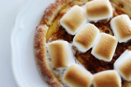 Marshmallow and sugar pizza on dish for sweet foodの写真素材