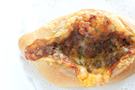 Cheese and mince meat French bread on white dish for breakfast