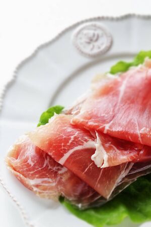 sliced ham on plate with copy space for gourmetの写真素材
