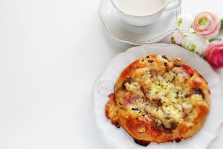 Homemade mushroom and cheese pizza on wooden board