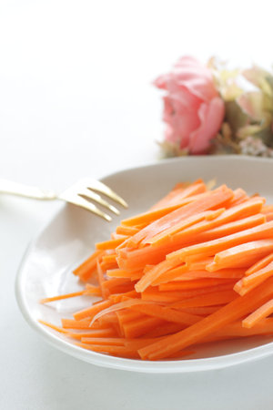 Chopped carrot on dish with copy spaceの写真素材