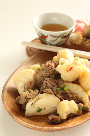 Chinese food, beef and cauliflower stir fried with chili pepper on topの写真素材