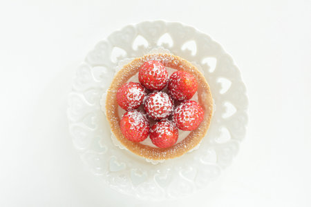 Homemade strawberry tart on white dish for gourmet dessertの写真素材