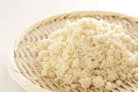 Soy refuse on bamboo basket for healthy food ingredient Okaraの写真素材