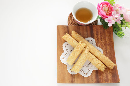 Chinese confectionery, egg roll on wooden plate