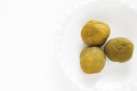 Japanese food, sweet Ume plum on white background
with copy space