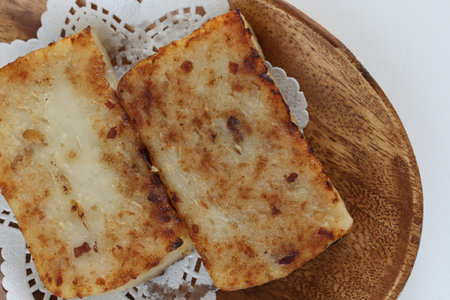 Chinese dumpling, Turnip cake on plate with copy space