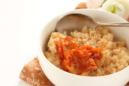 Korean food, chinese cabbage kimchi and congee with sesame seedの写真素材