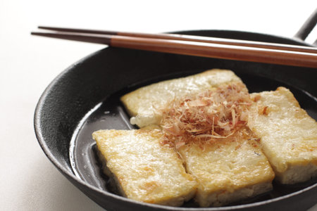 Japanese food, pan fried tofu and Katsuobushi in skillet panの写真素材