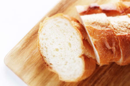 Slide French bread on cutting board with copy spaceの写真素材